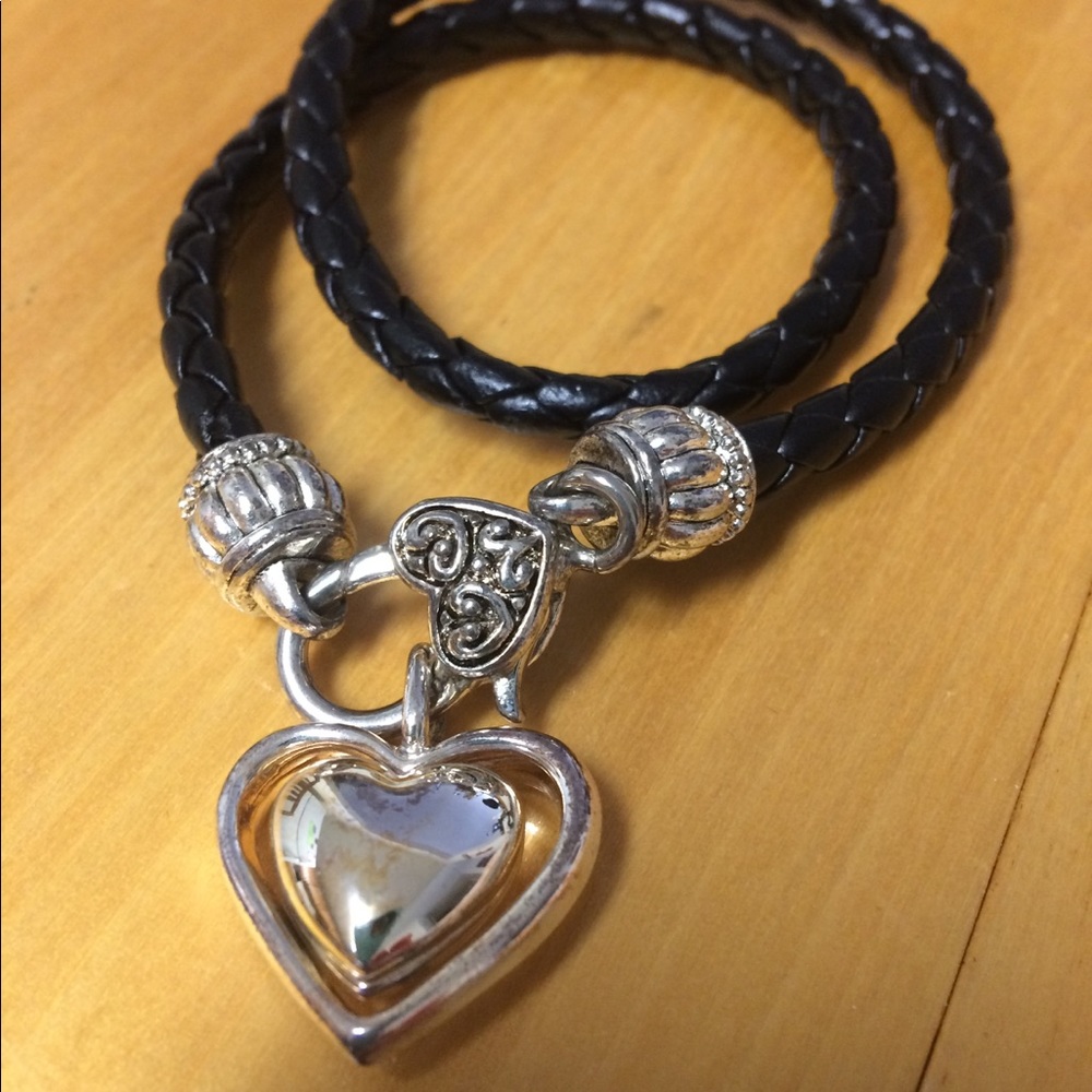 Braided brown bracelet with silver heart.